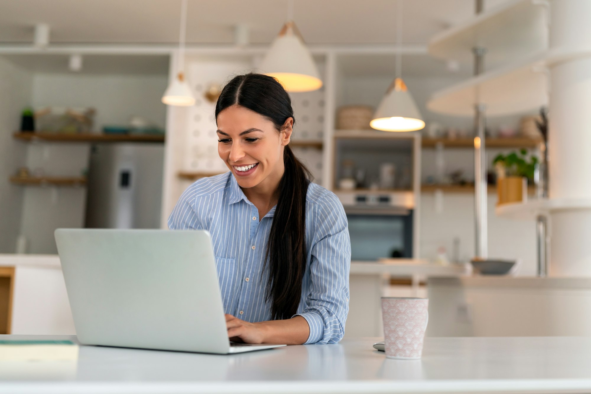 Happy young woman freelancer working on computer, studying online, shopping in internet store.